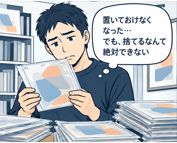 1コマ目:袋に入ったセル画を手に「置いておけなくなった…でも、捨てるなんて絶対できない」と悩む男性